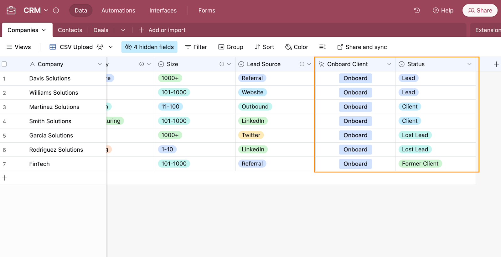 An Airtable CRM containing a Companies database with two of the fields, Onboard Client and Status, highlighted.