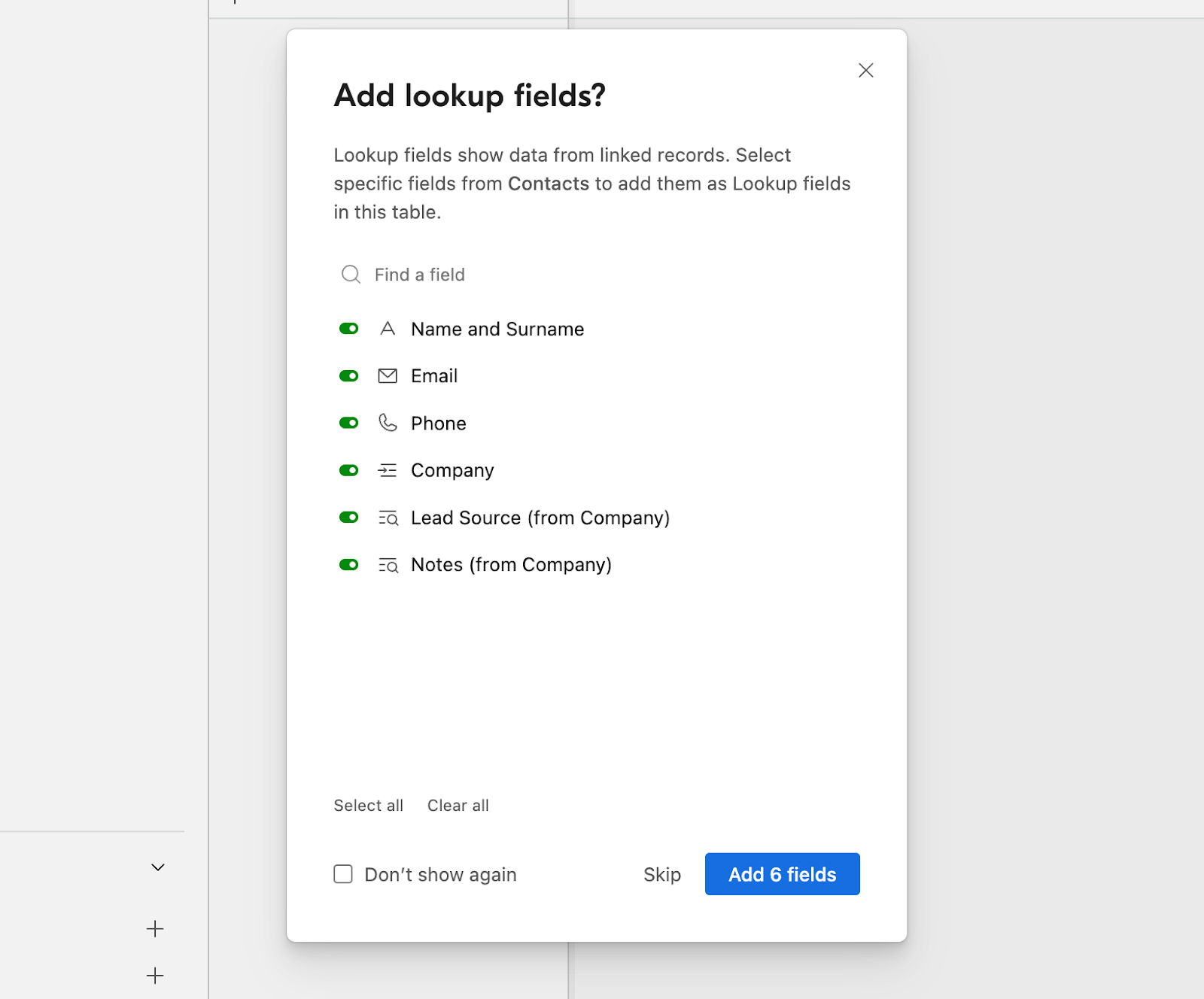 Popup in Airtable to choose which lookup fields to add to a linked field in a database.